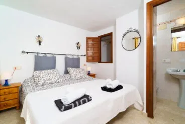 Dormitorio con baño Casa Escabusso Aguila Rent a Villa
