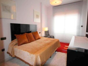 Dormitorio con cama matrimonio Atina Inmobiliaria