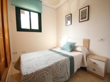 Dormitorio doble del apartamento de Atina Inmobiliaria