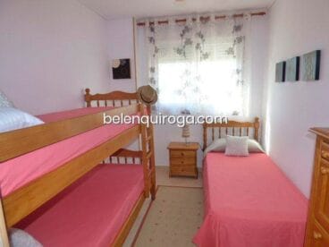 Dormitorio con tres camas Inmobiliaria Belen Quiroga
