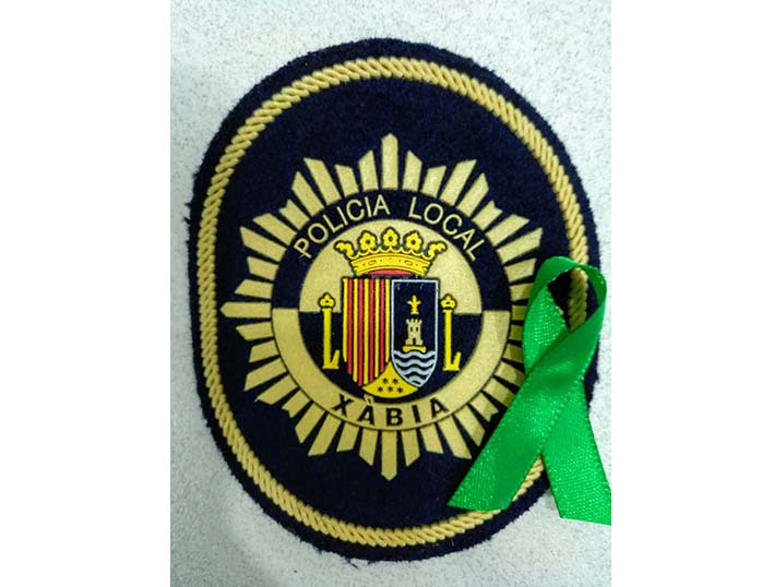 Lazo verde en el escudo de Policía Local
