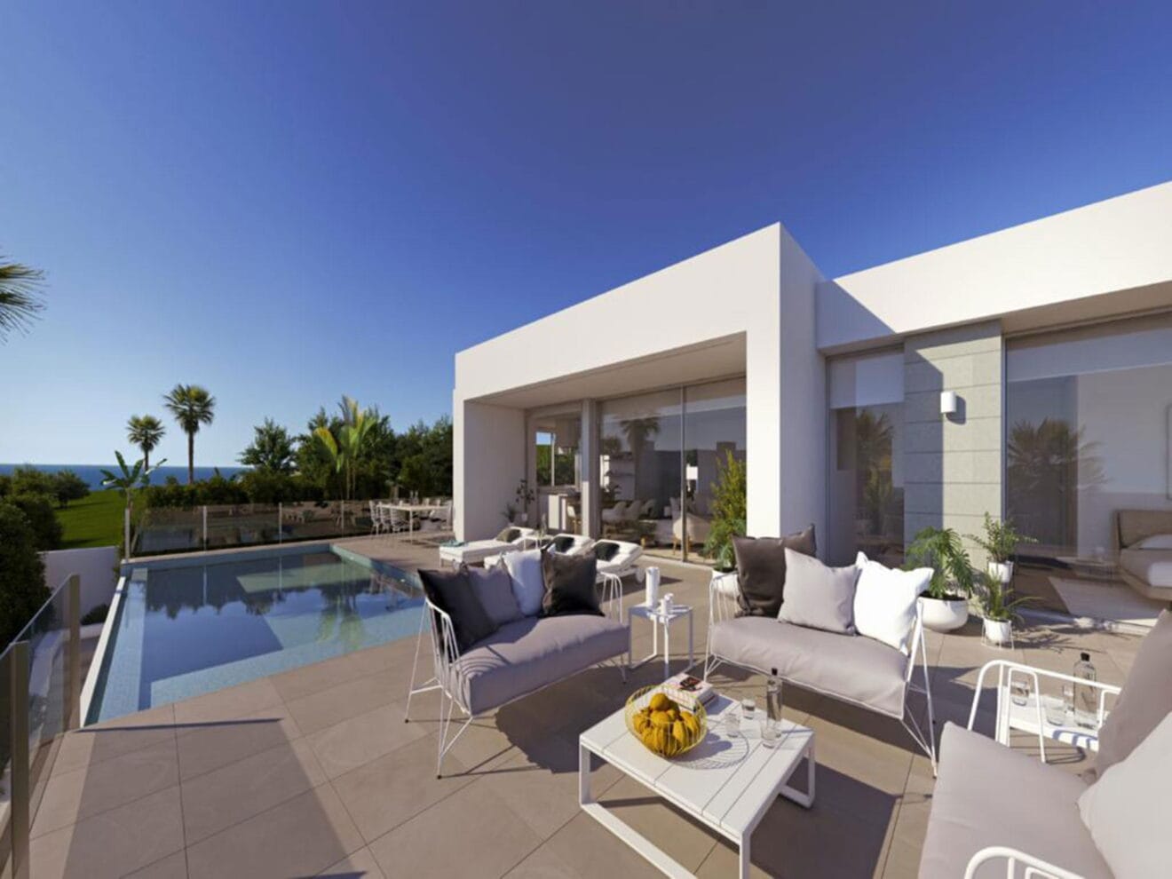 Terraza y entorno de la piscina en una villa de lujo en Cumbres del Sol - Atina Inmobiliaria