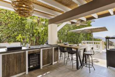 Cocina exterior cubierta, de estilo industrial