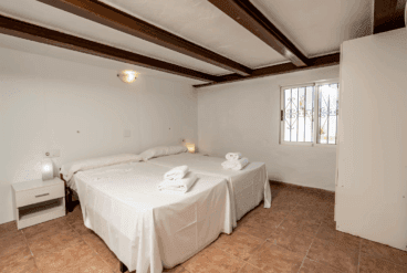 Dormitorio de la casa abuhardillado