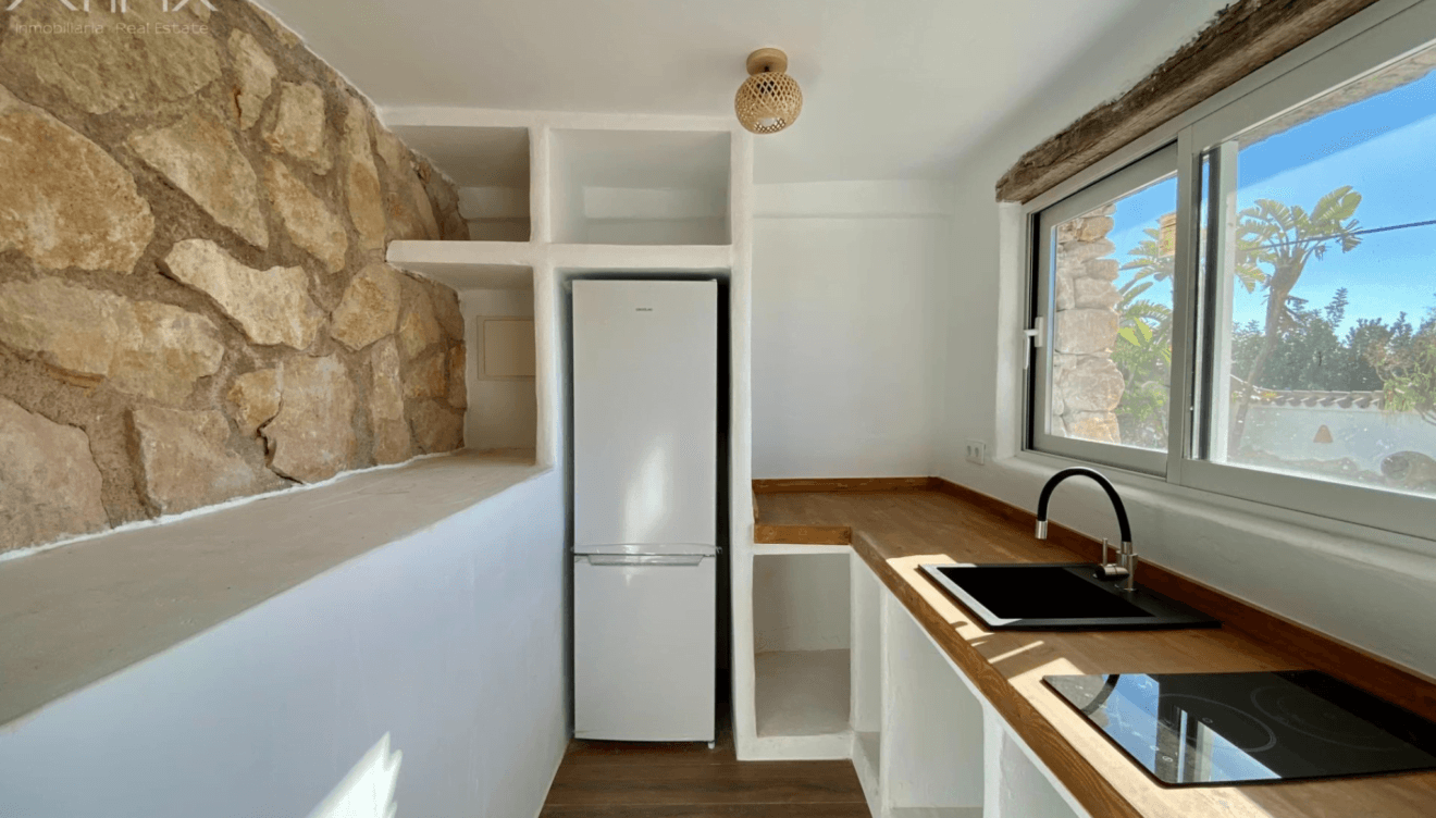 Una cocina en la vivienda de invitados
