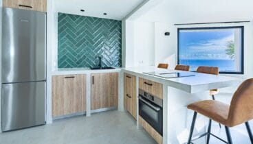 Cocina totalmente equipada con diseño moderno y funcional